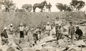 Photo of internees and guards at a road construction